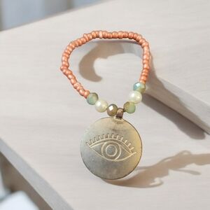 Orange and copper bracelet